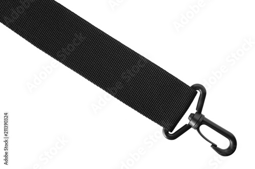 Black belt rope strap lanyard. Hanging plastic clasp snap latch hook carabiner. Isolated macro closeup, horizontal copy space and large detailed closeup. Help concept metaphor