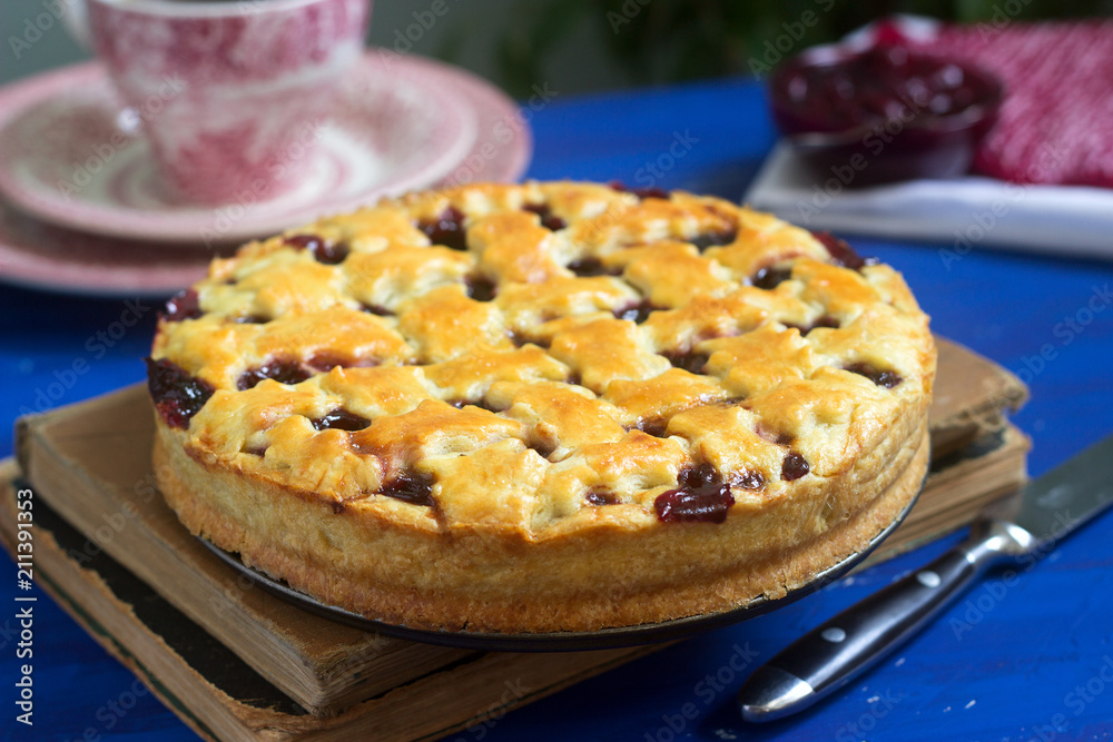 A traditional American or European cherry pie made of shortcake. Rustic style.