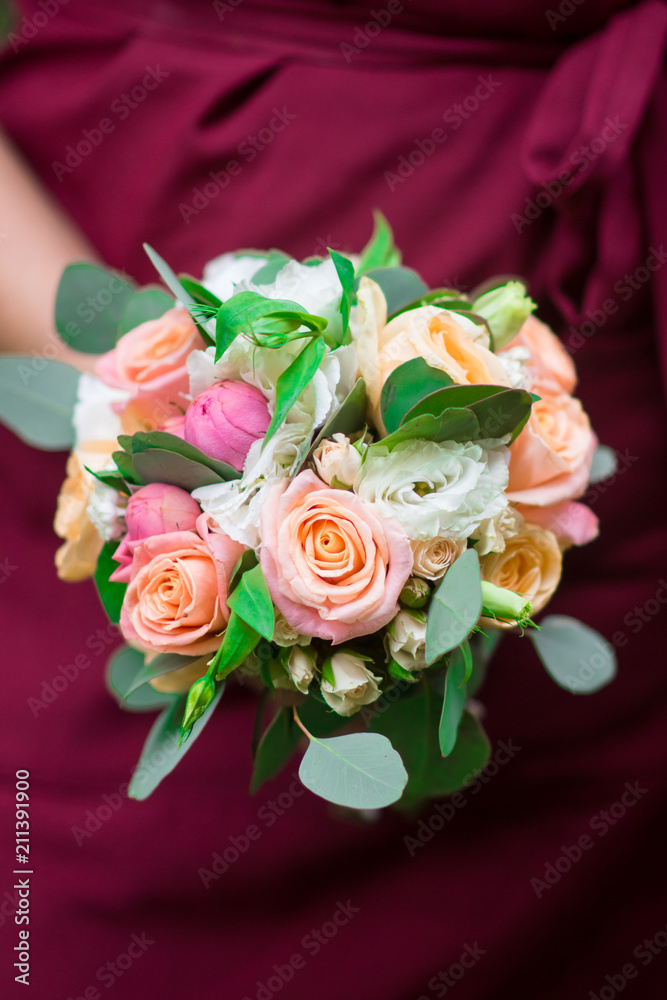 Wedding bouquet in hands of the woman