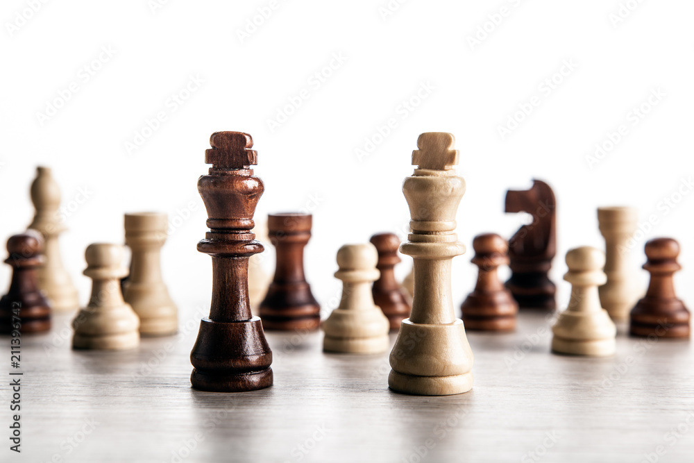 chess pieces on a grey background and black and white chess kings chess pieces on a grey background and black and white chess kings