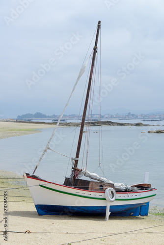 wooden sailing yacht at anchor