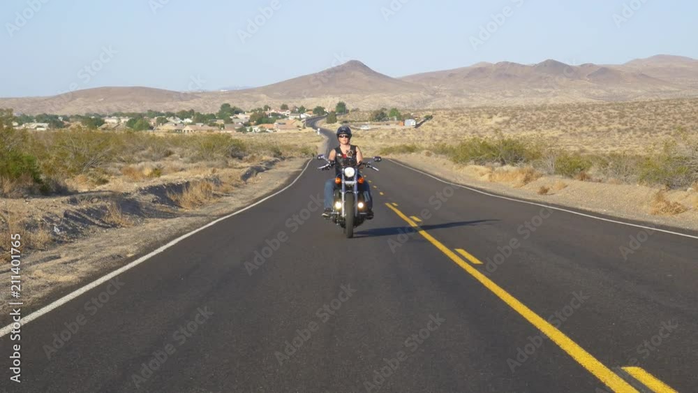 Woman on motorcyle with dog Woman on motorcyle with dog
