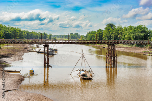 Landscape view at the fishing boats on the river in Cambodias. photo