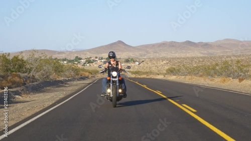 Woman on motorcyle with dog