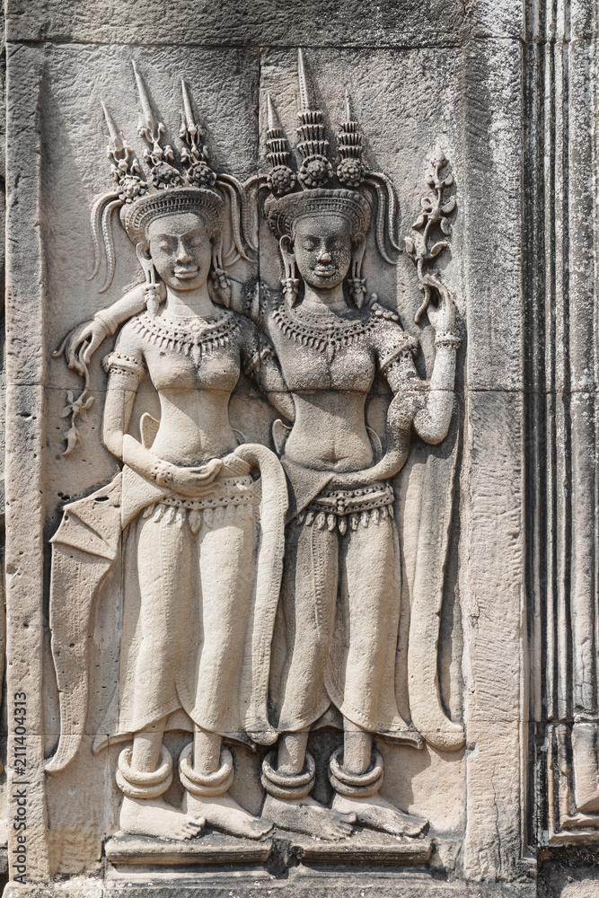 Apsaras, dancing girls at stone facade of Angkor Wat Temple in Angkor, Cambodia.