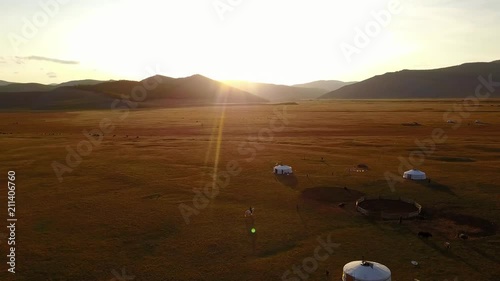 Aerial view from a drone of traditional gers in a Mongolian steppe on an autumn day. Lake Khuvsgol, Mongolia. photo