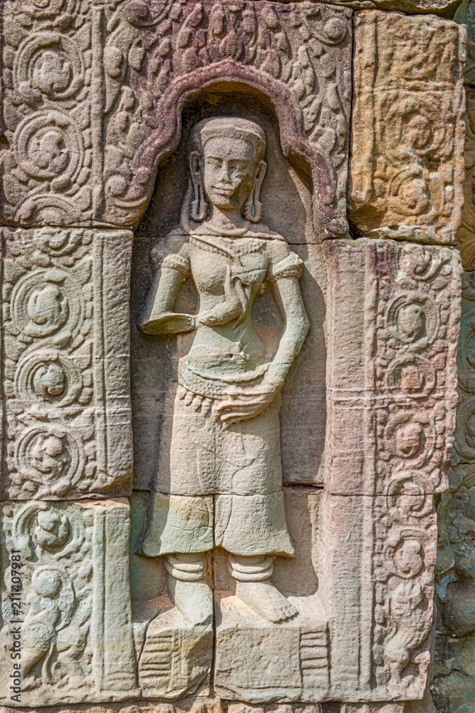 Carvings on the wall at Ta Som a small temple at Angkor, Cambodia,