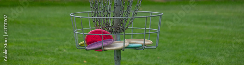 Disc Golf basket full of disc