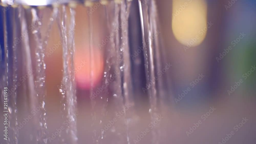 shower head from which jets of water are poured shower head from which jets of water are poured