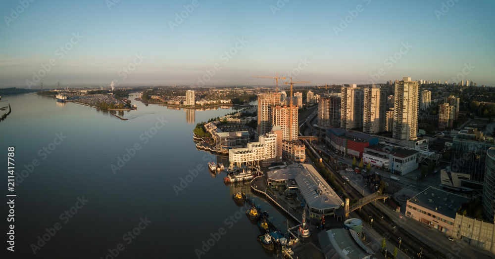 Aerial view of Downtown city during a vibrant sunrise. Taken in New Westminster, Greater Vancouver, British Columbia, Canada.