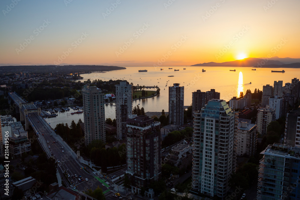 Fototapeta premium Beautiful aerial cityscape view during a vibrant sunny sunset. Taken in Downtown Vancouver, British Columbia, Canada.