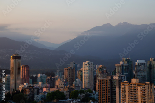 Aerial view of the Downtown City Residential Buildings during a sunny sunset. Taken in Vancouver, BC, Canada.