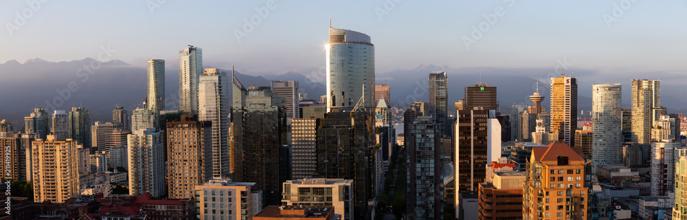 Downtown Vancouver, British Columbia, Canada - May 16, 2018: Aerial view of the modern city skyline during a sunny sunset.