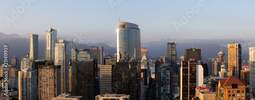 Downtown Vancouver, British Columbia, Canada - May 16, 2018: Aerial view of the modern city skyline during a sunny sunset.