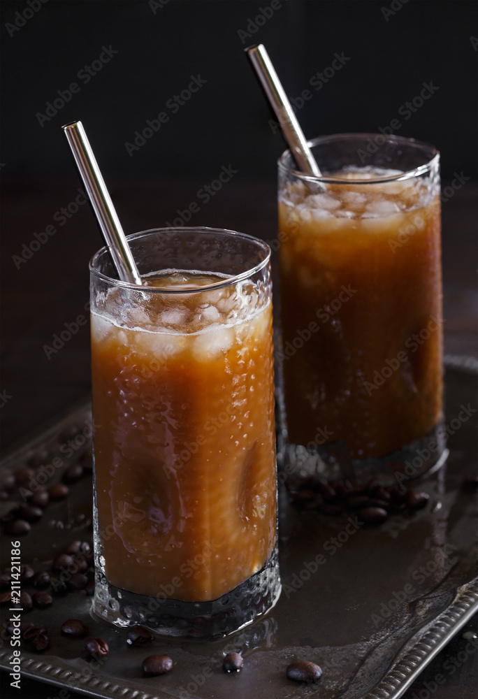 Twi Glasses of Refreshing Iced Coffee with Stainless Steel Drinking Straws Twi Glasses of Refreshing Iced Coffee with Stainless Steel Drinking Straws