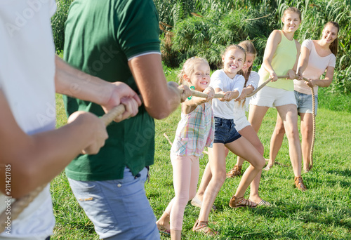 children and adults playing active games