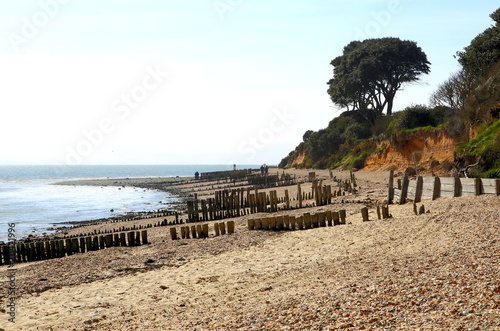 Pebble beach with worn defences. Lepe Country Park, Exbury, Southampton, Hampshire, England, United Kingdom. photo