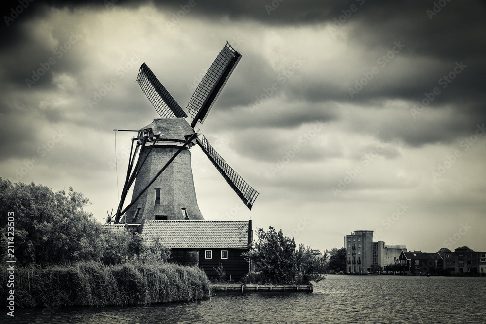 Windmill near Amsterdam with dramatic clouds, Netherlands