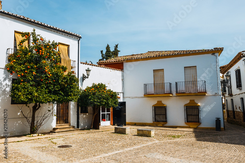 view of typical street in historic district of Ronda, Spain