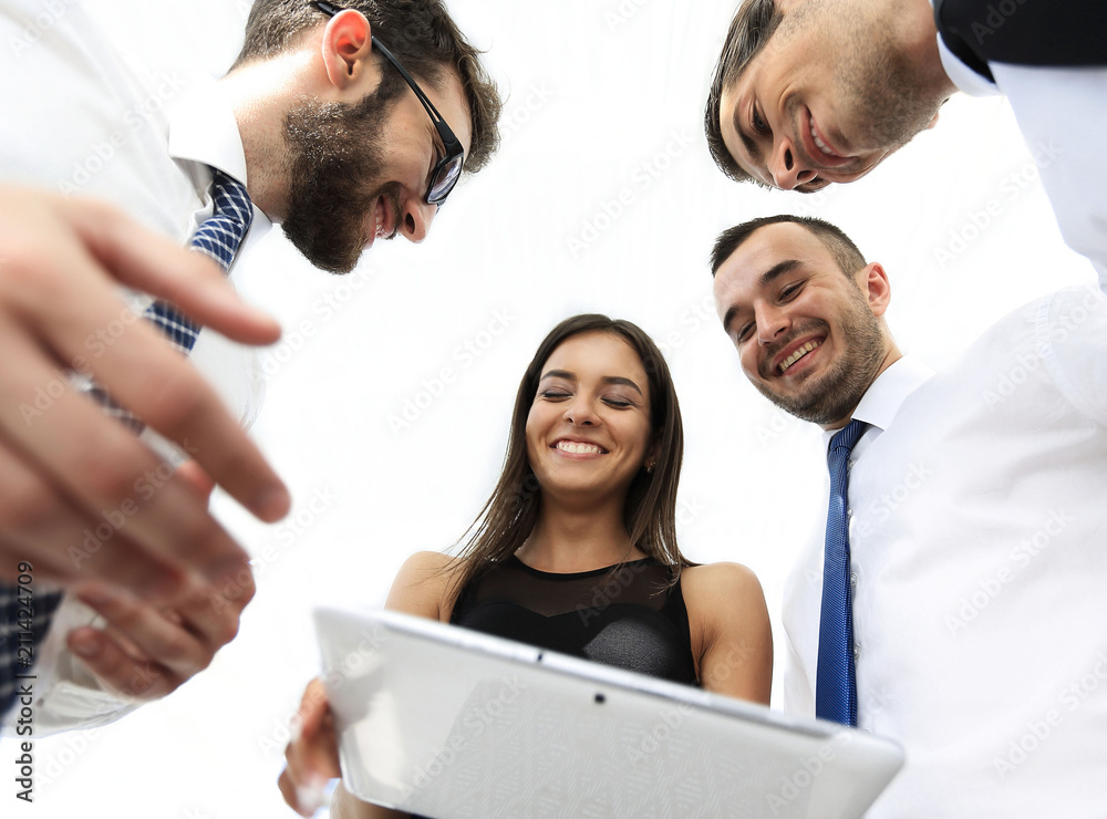 bottom view of business team looking at digital tablet bottom view of business team looking at digital tablet