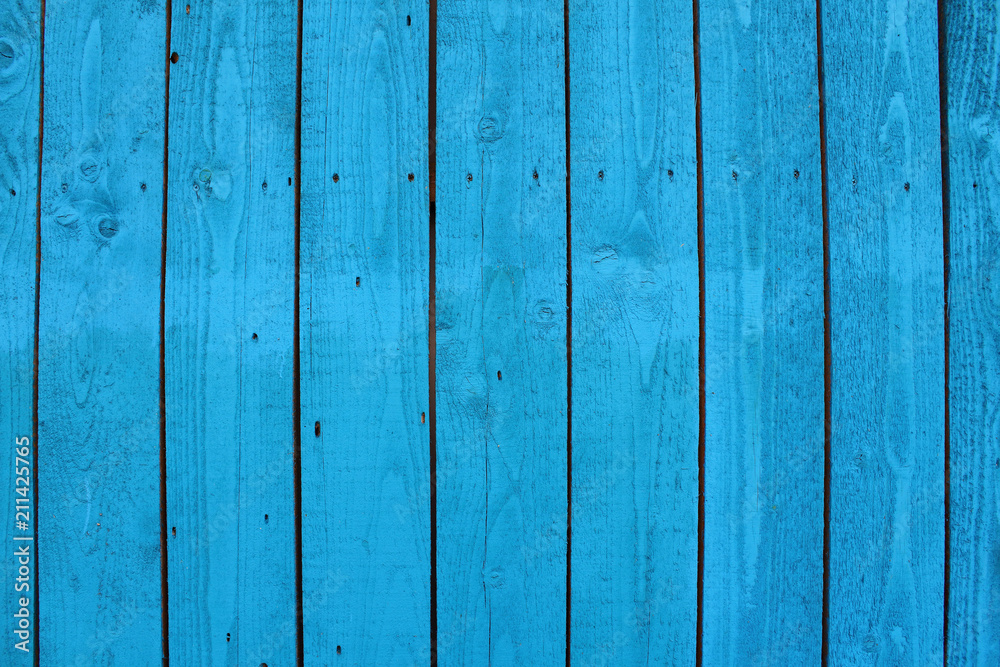 Boards painted in blue paint. Vertical view. Close-up. Background. Texture. Boards painted in blue paint. Vertical view. Close-up. Background. Texture.