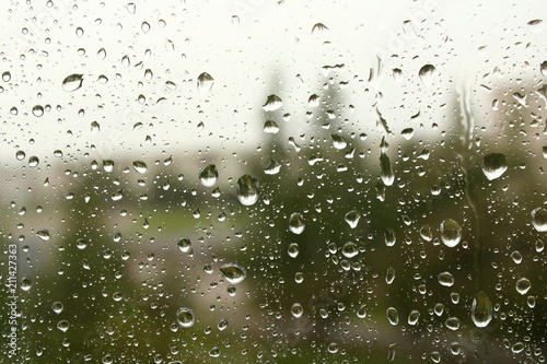 Raindrops on the windowpane. Rain drops on the glass. Close-up. Background. Texture.