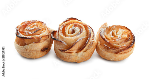 Tasty apple roses from puff pastry on white background