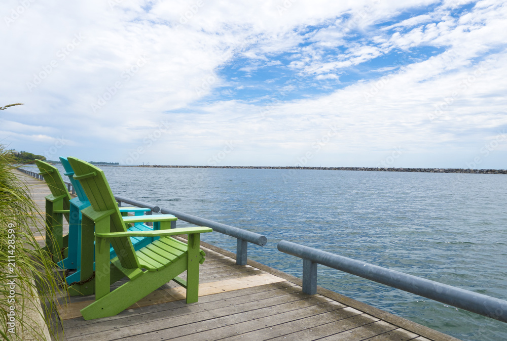 Blue and green muskoka cottage chairs by the toronto waterfront 
