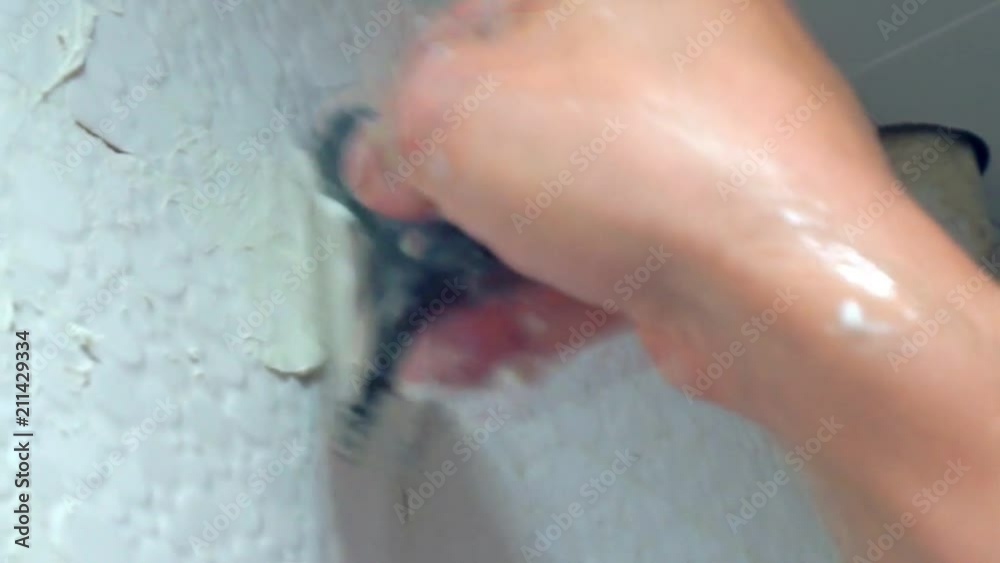cementing of seams between ceramic tiles.close-up cementing of seams between ceramic tiles.close-up