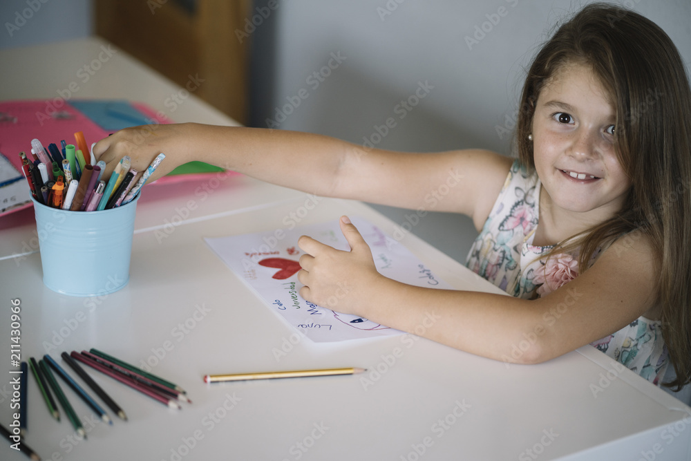 Little girl drawing on the table Little girl drawing on the table