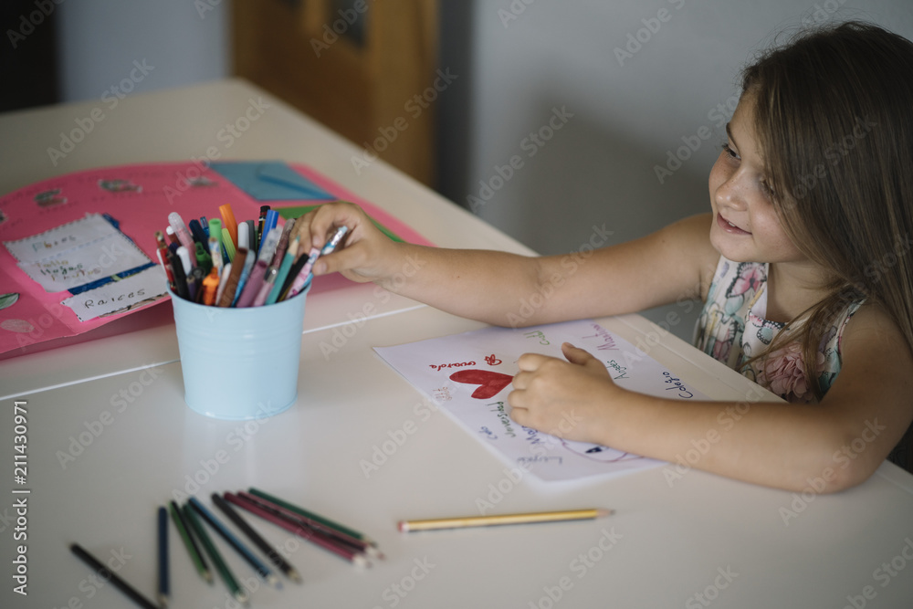 Little girl drawing on the table Little girl drawing on the table