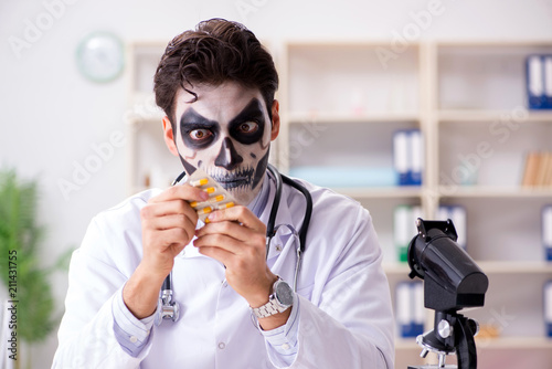 Scary monster doctor working in lab photo