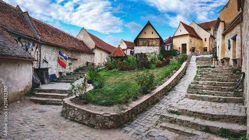 Rasnov Fortress with beautiful medieval stone houses and stone stairway, Brasov county, Romania. Panoramic view photo
