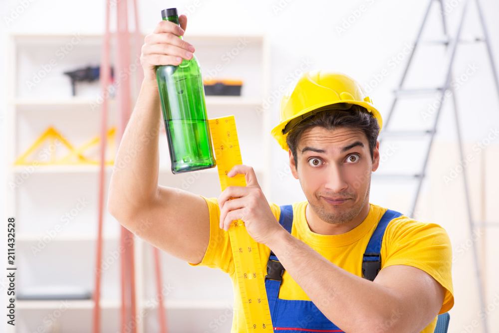 Drunk engineer working in the workshop Drunk engineer working in the workshop