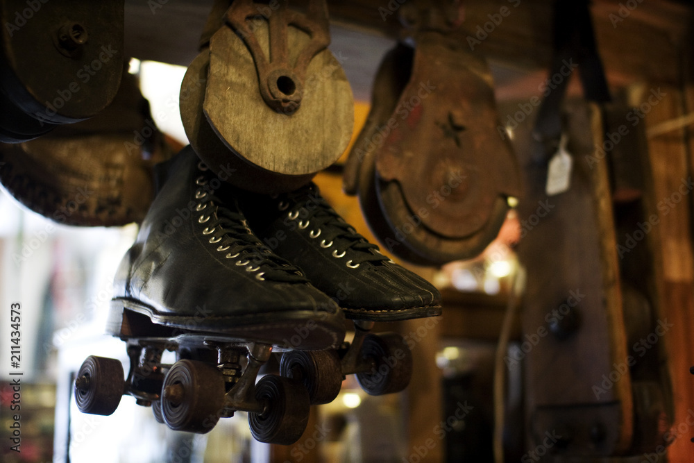 Hanging antique roller skates and pulleys Hanging antique roller skates and pulleys