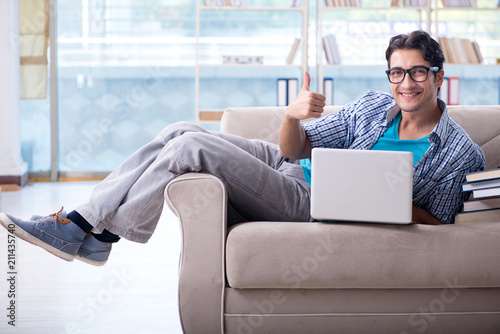 Caucasian student with laptop preparing for university exams