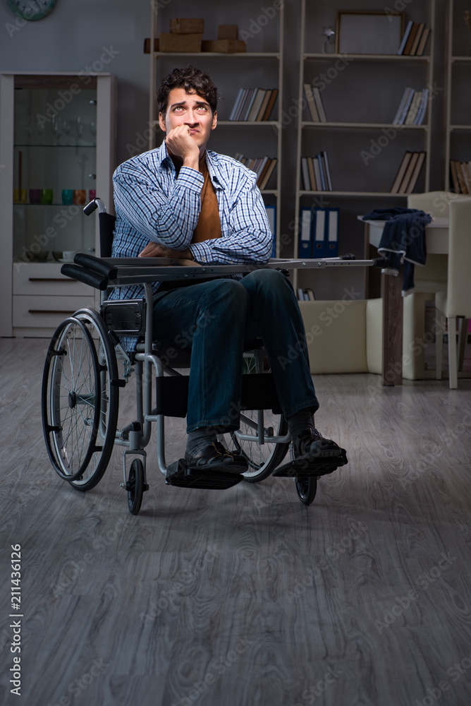 Man suffering from depression at wheelchair Man suffering from depression at wheelchair