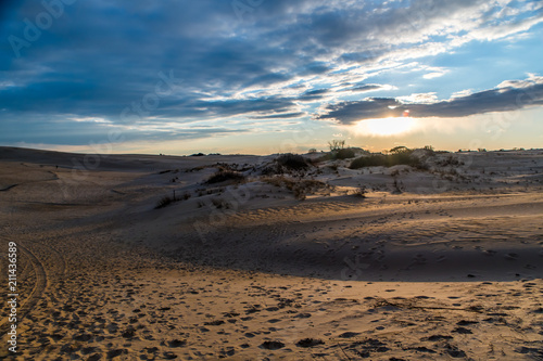 Fototapeta Naklejka Na Ścianę i Meble -  Sunset over the majestic dunes at Jockey's Ridge State Park