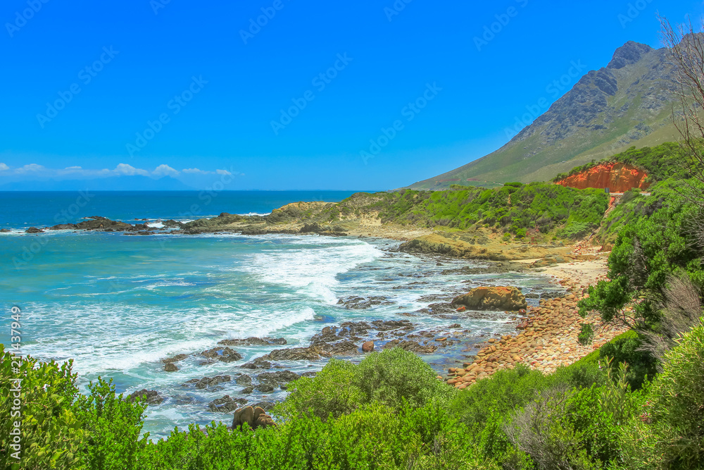 The Route 44 from Gordon s Bay to Rooi Els in False Bay, Western Cape, South Africa within Kogelberg Biosphere Reserve. The Clarence Drive is a popular road trip and scenic coastal mountain road.