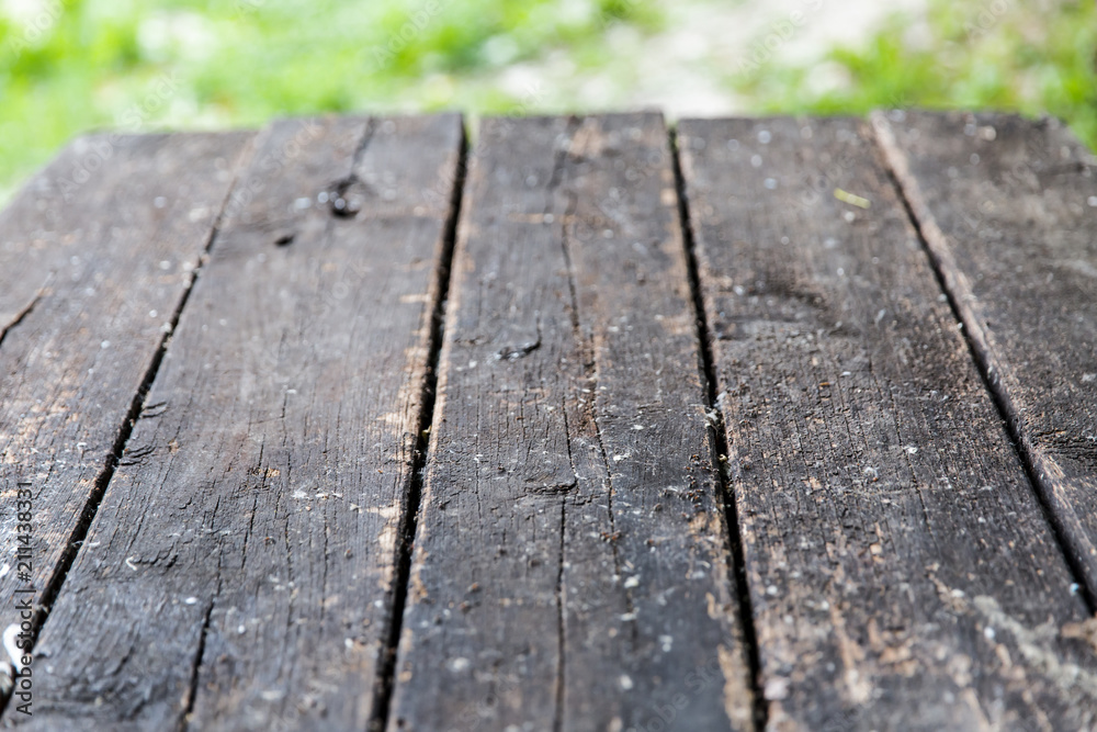 Abstract background from wooden table top with blurred nature Abstract background from wooden table top with blurred nature