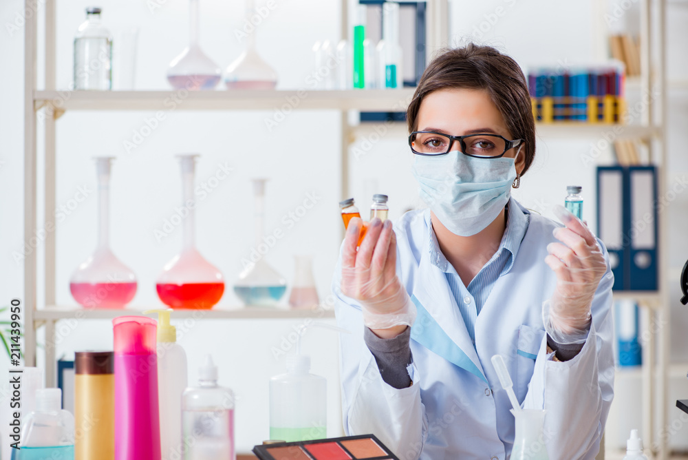 Lab chemist checking beauty and make-up products Lab chemist checking beauty and make-up products