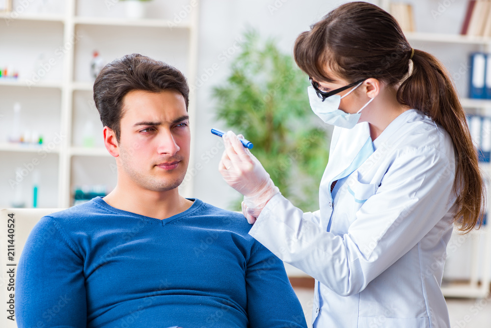 Fototapeta premium Doctor checking up patient in first aid concept