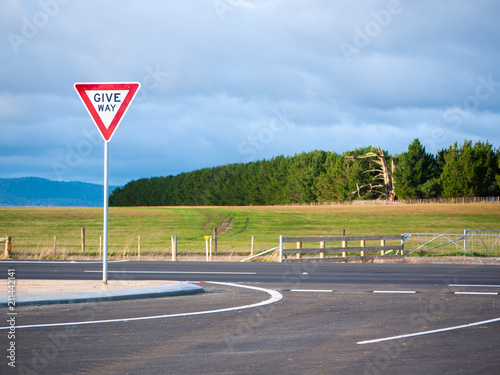 Give way sign on roadside of country highway. Tasmania, Australia.