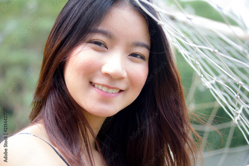Fototapeta premium Portrait of thai china adult beautiful girl relax and smile