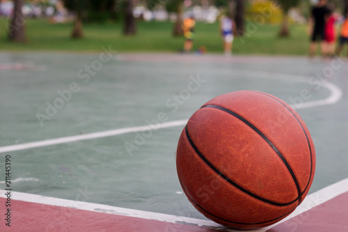 Basketball ball on corner of the outdoors court