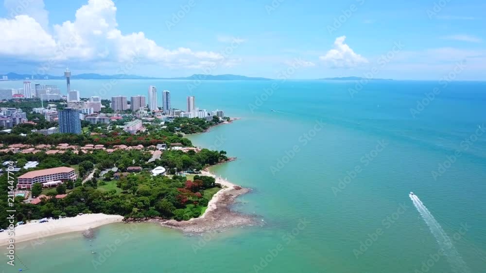 4k Pattaya Beach coast dolly with slowly waving and speedboat sailing ...