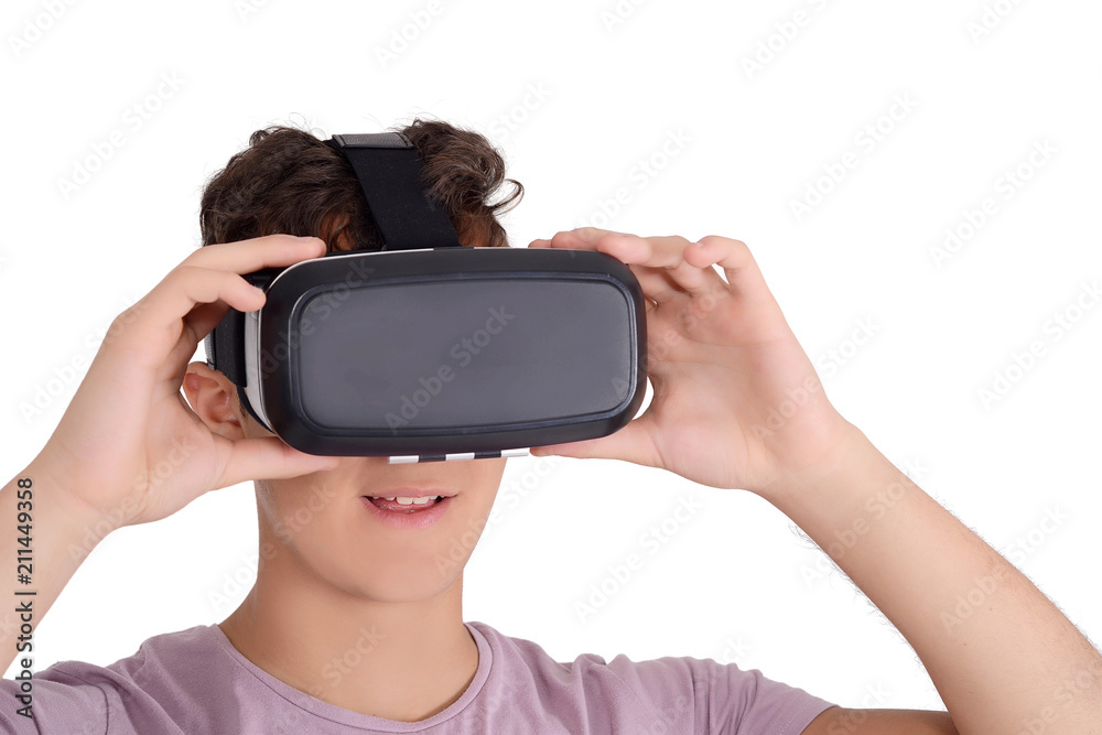 Joyful teen boy using VR goggles