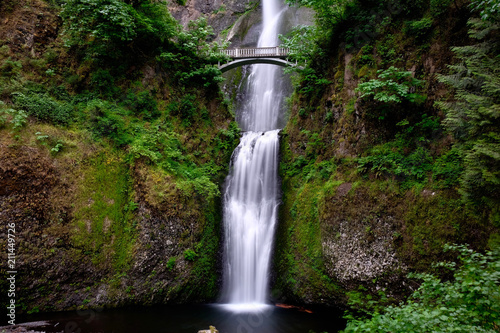 Fototapeta Naklejka Na Ścianę i Meble -  Bridge over waterfalls. Multnomah Falls in Oregon. Beautiful waterfalls near Portland. Second highest year-round waterfall in the US. Oregon. United States of America.