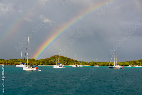 double rainbow over sailboats © chrissie