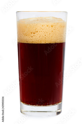 Cold glass of dark beer or kvass with foam isolated on white background.